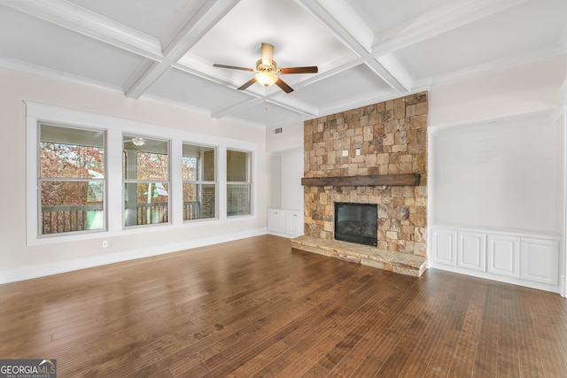 unfurnished living room with beam ceiling, wood-type flooring, a fireplace, and coffered ceiling