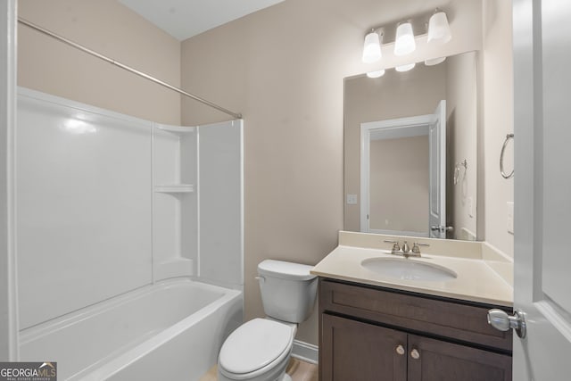 full bathroom with bathtub / shower combination, vanity, hardwood / wood-style flooring, and toilet