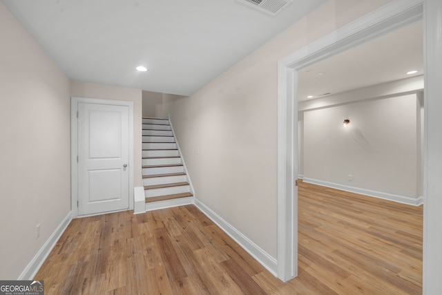 stairway with wood-type flooring