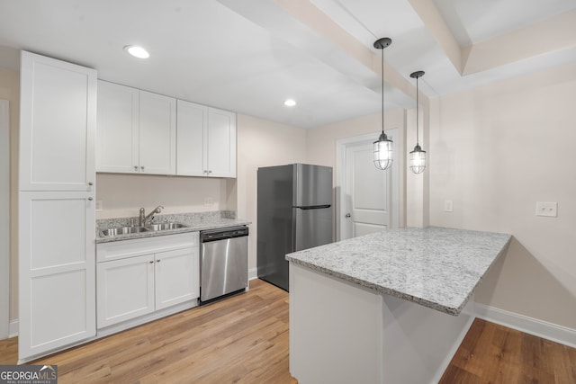 kitchen featuring light wood-type flooring, stainless steel appliances, white cabinetry, and sink