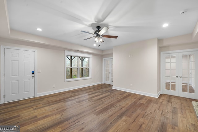 entrance foyer featuring french doors, dark hardwood / wood-style floors, and ceiling fan