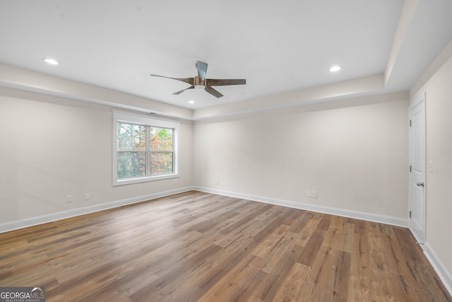 unfurnished room with hardwood / wood-style flooring and ceiling fan