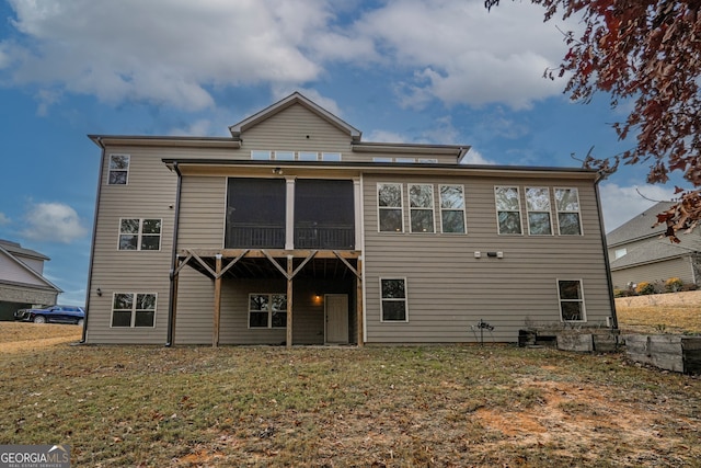 back of property featuring a sunroom