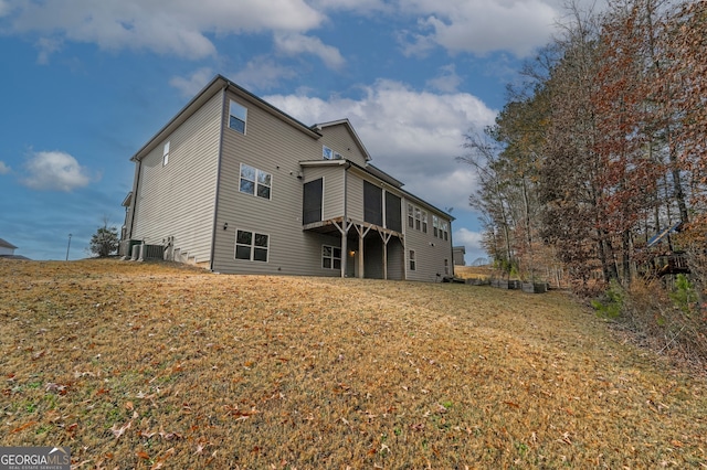 back of property with central AC