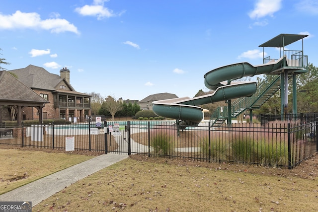 exterior space featuring a yard and a swimming pool