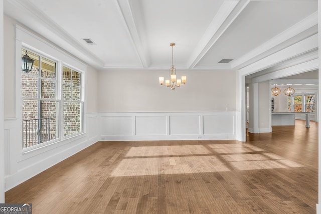 unfurnished dining area with beamed ceiling, wood-type flooring, and an inviting chandelier