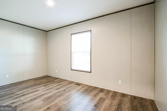 empty room featuring hardwood / wood-style floors