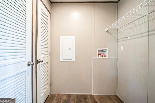 laundry area with electric panel, hookup for a washing machine, and dark hardwood / wood-style floors