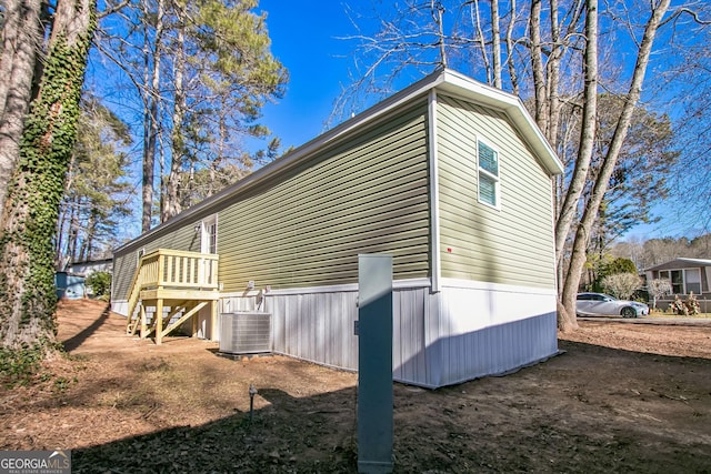 view of home's exterior with central AC unit