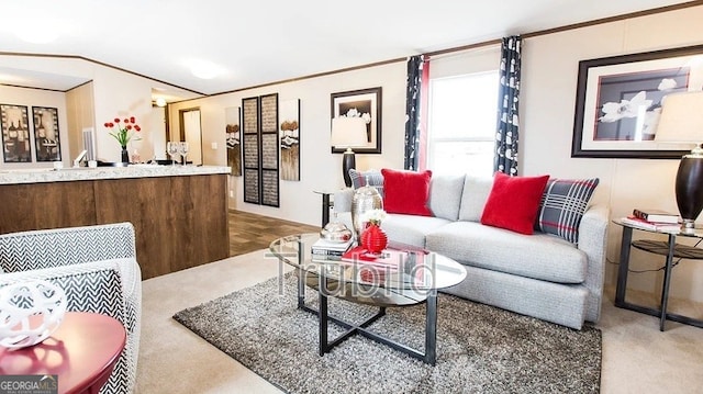 carpeted living room featuring ornamental molding