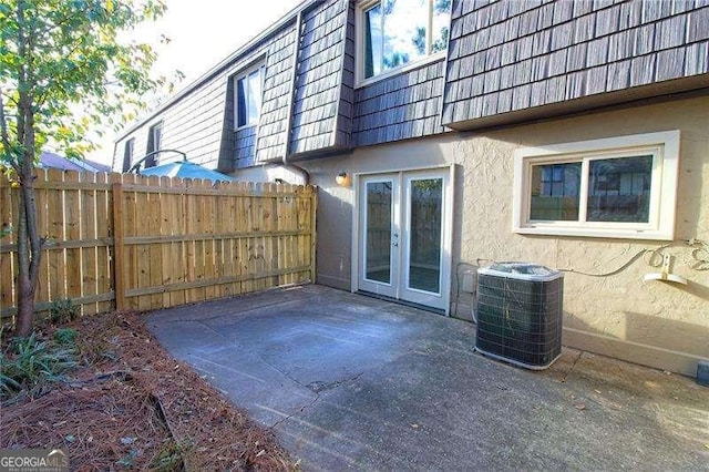 view of patio with french doors and central AC unit