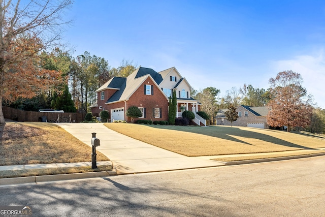 view of front of house with a front yard and a garage