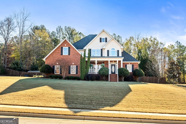 view of front of property featuring a porch and a front lawn