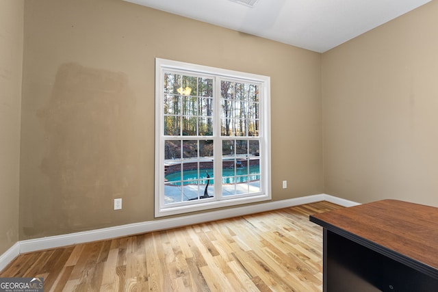 spare room with light wood-type flooring