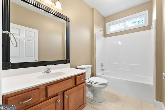 full bathroom featuring toilet, tile patterned floors, vanity, and bathing tub / shower combination