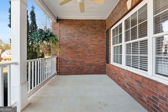 balcony featuring ceiling fan and a porch