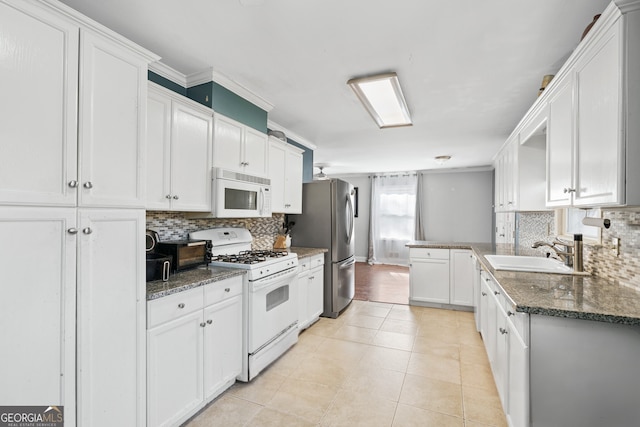 kitchen with white cabinetry, crown molding, white appliances, and sink