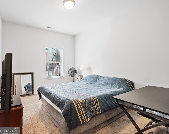 bedroom with carpet floors and visible vents