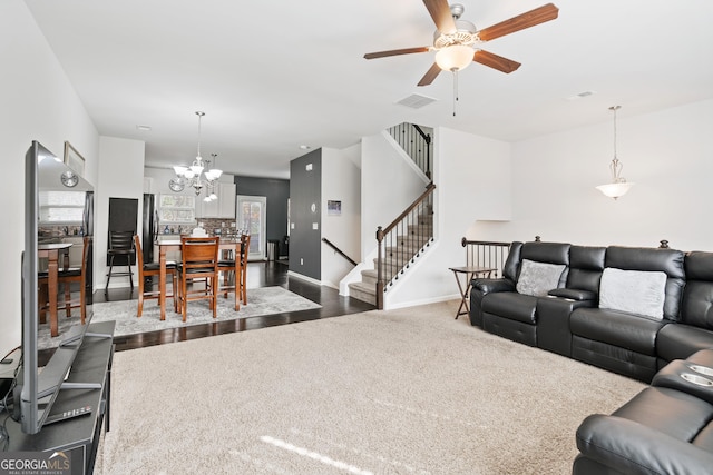 4192 Integrity Way, Powder Springs, GA 30127 - living room with a ceiling fan, stairway, dark carpet, and a chandelier