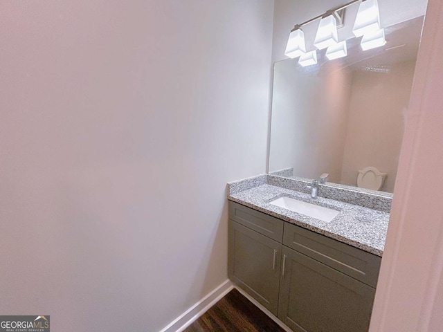 bathroom with vanity and hardwood / wood-style flooring