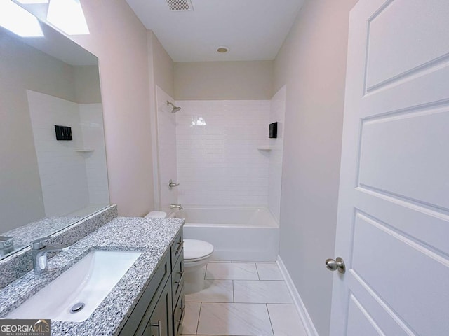 full bathroom with tile patterned floors, vanity, toilet, and tiled shower / bath combo