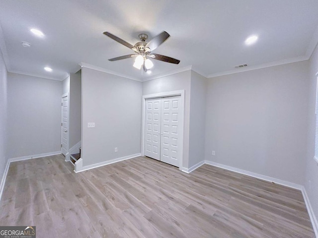 unfurnished bedroom with ceiling fan, light hardwood / wood-style flooring, and crown molding