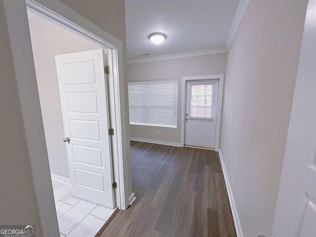 doorway to outside featuring hardwood / wood-style floors and ornamental molding