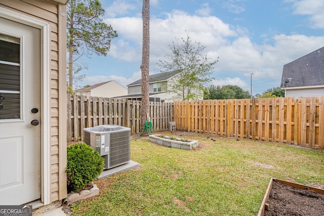 view of yard featuring central AC unit