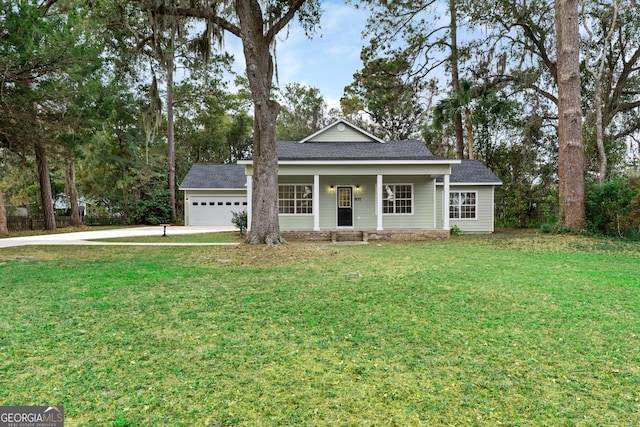 view of front of house with a front yard and a garage