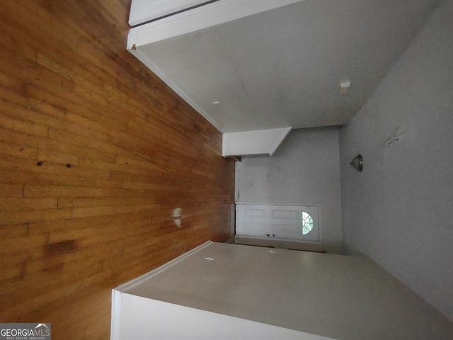 interior space featuring wooden walls