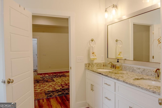 bathroom with hardwood / wood-style flooring and vanity