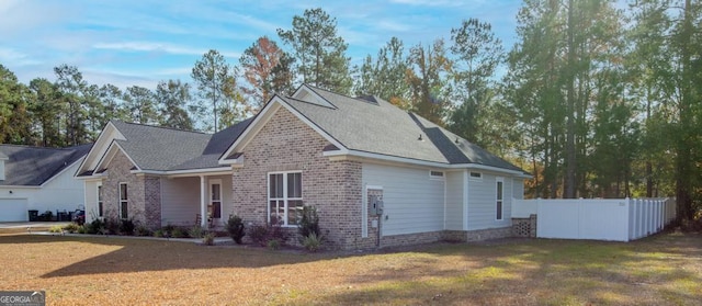 view of side of property featuring a yard