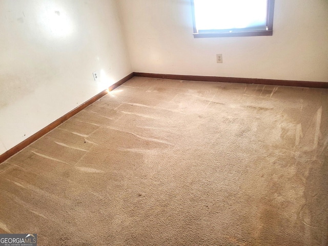 unfurnished room featuring carpet flooring