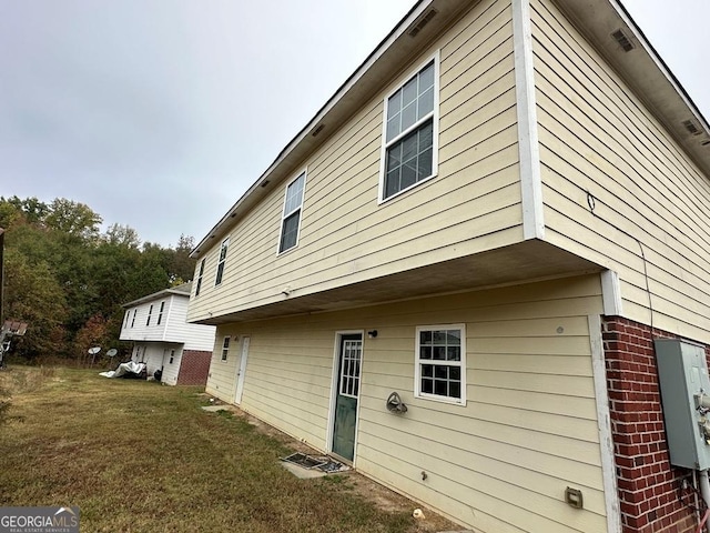 view of property exterior with a yard