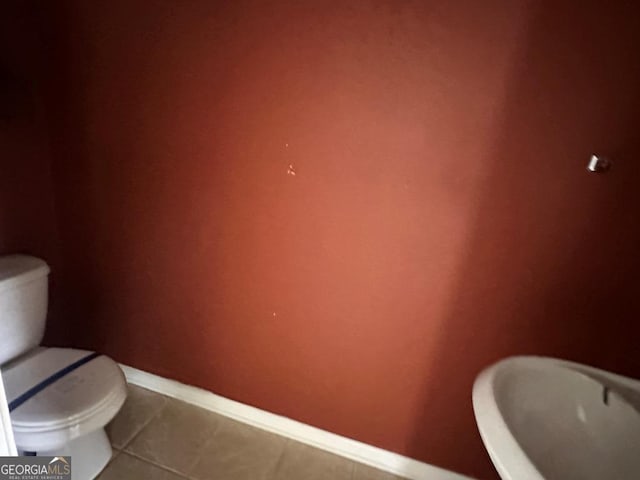 bathroom featuring tile patterned flooring and toilet