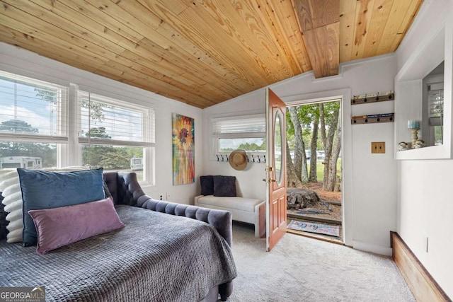 carpeted bedroom with vaulted ceiling with beams and wooden ceiling