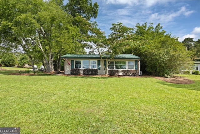 ranch-style home with a front lawn