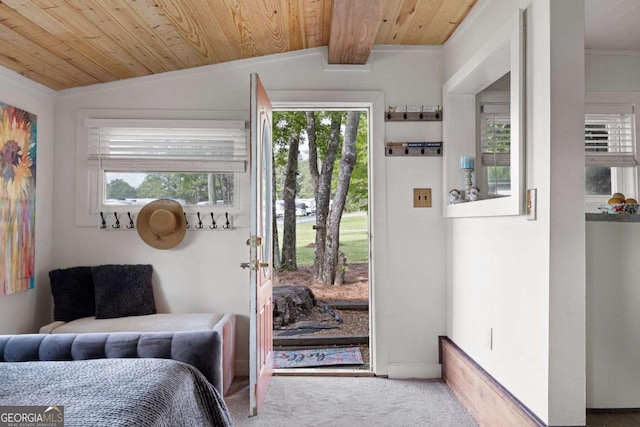 bedroom with lofted ceiling with beams, wood ceiling, and multiple windows