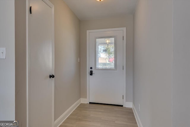 doorway to outside with light hardwood / wood-style flooring