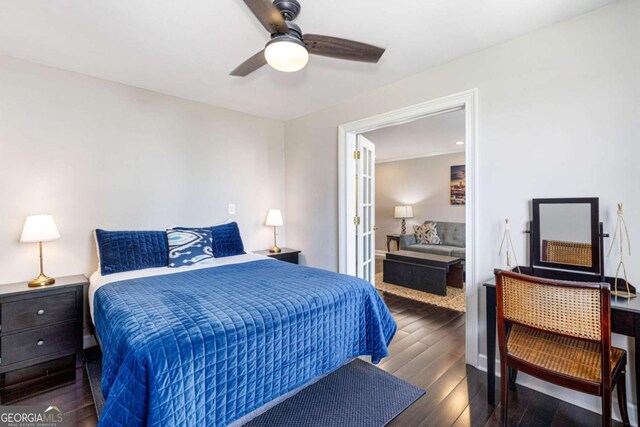 bedroom featuring ceiling fan and dark wood-type flooring