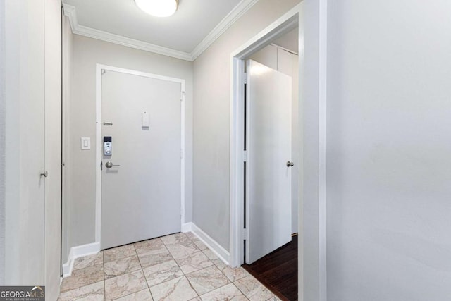 foyer entrance featuring crown molding