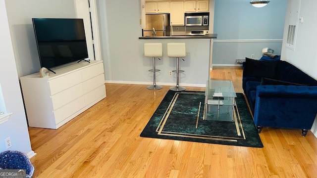 living room featuring light wood-type flooring