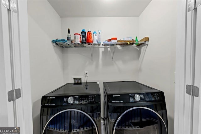 washroom with washer and clothes dryer