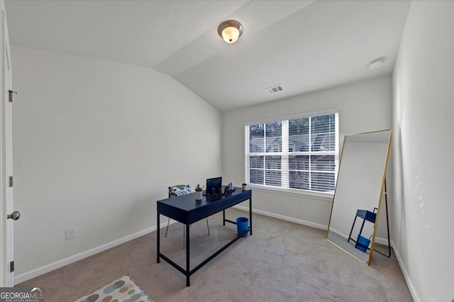 office space featuring light colored carpet and lofted ceiling