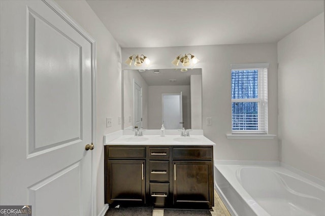 bathroom with a bathtub and vanity