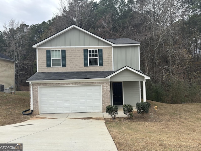 view of front property with central air condition unit, a front yard, and a garage