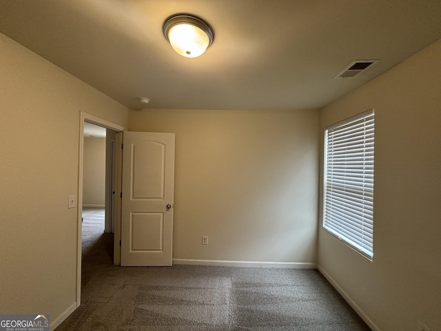 unfurnished room featuring carpet floors