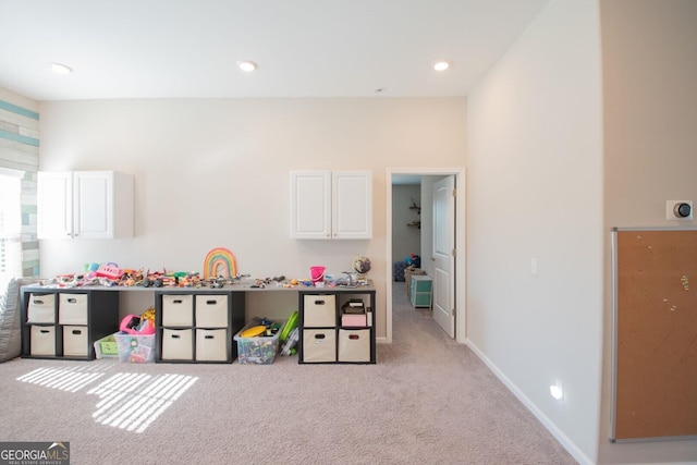 game room featuring light colored carpet