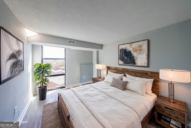 bedroom featuring hardwood / wood-style flooring