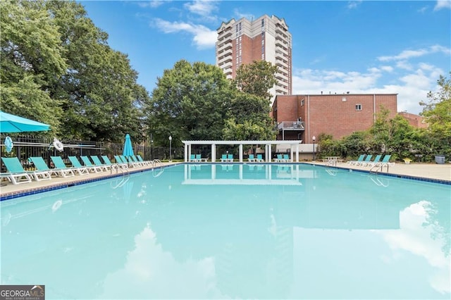 community pool featuring fence